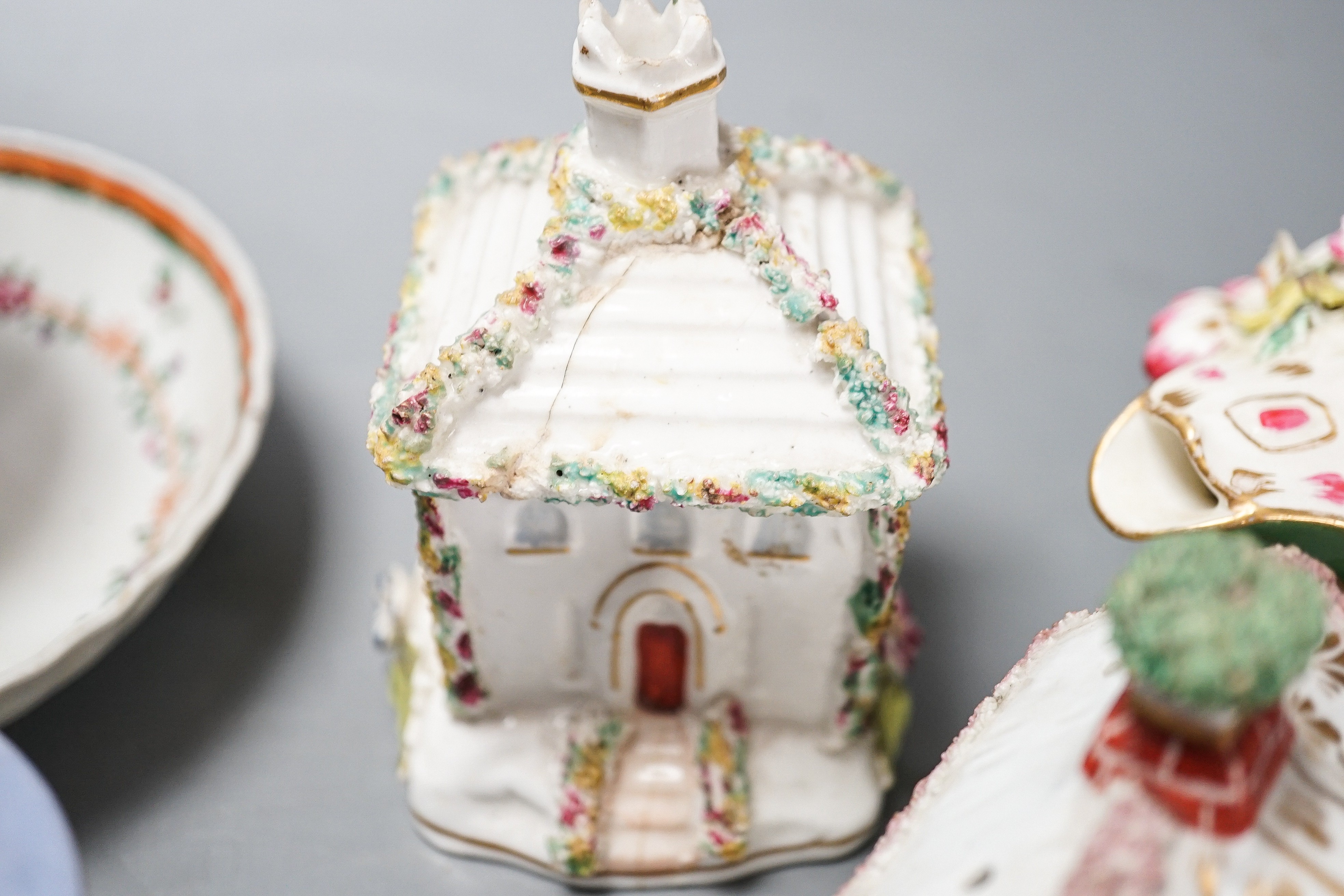 Three Chinese export famille rose tea bowls and two saucers, three Staffordshire porcelain cottage pastille burners and an English porcelain cream boat